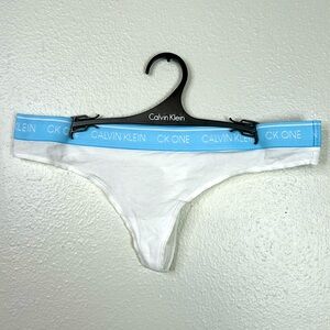 NWOT Set of 4 Calvin Klein White Thong with Light Blue Band